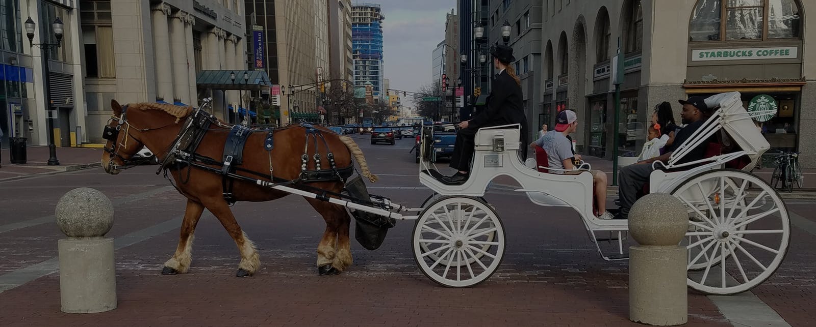 kids going to prom in horse and carriage